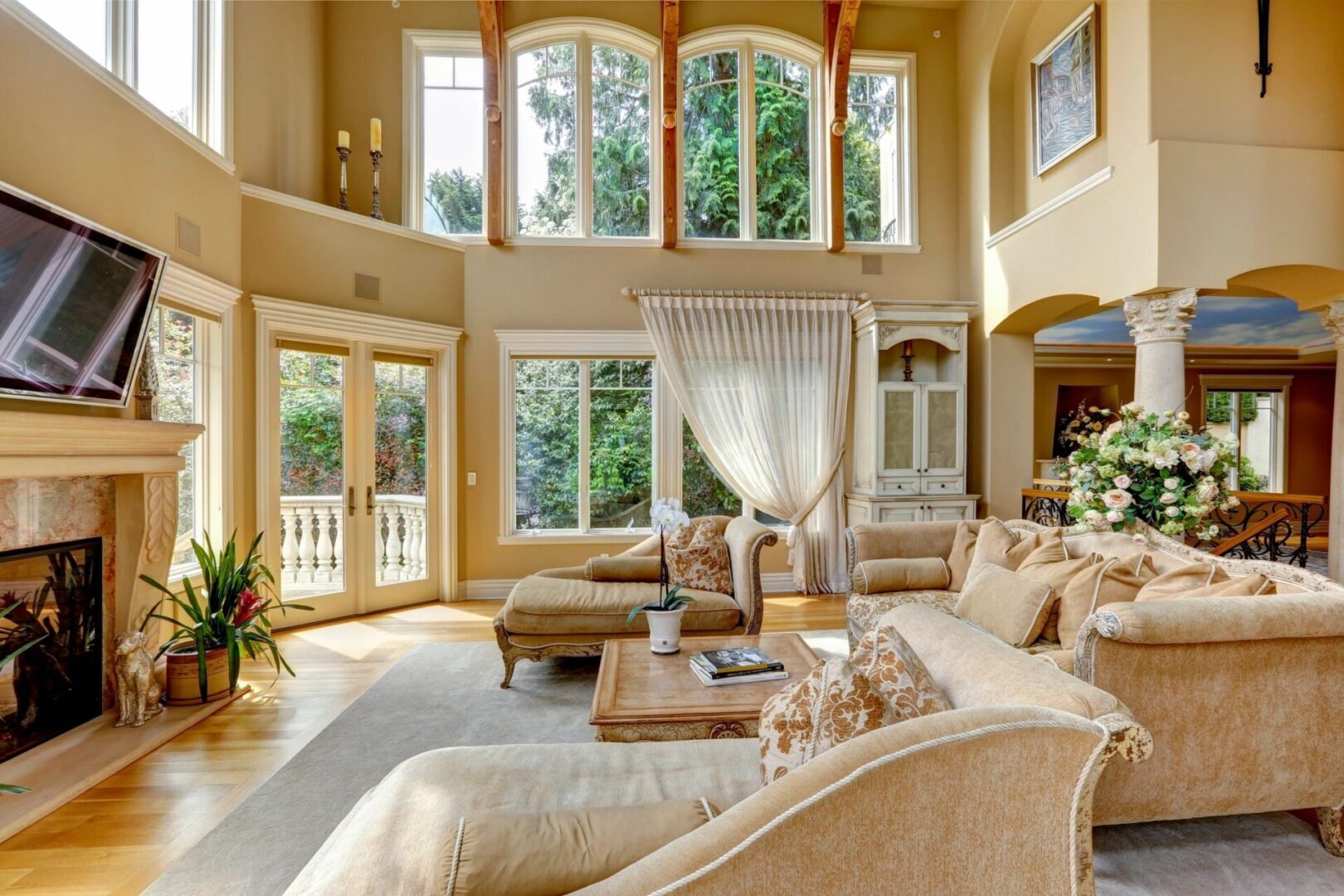A living room with two large windows and a couch